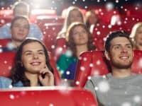 Cinema Entertainment And People Concept Happy Friends Watching Movie In Theater With Snowflakes