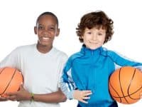 Two Adorable Children With Basketball On A Over White Background