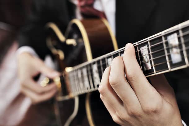 Jazz Musician Playing With Electric Guitar Short Depth Of Field