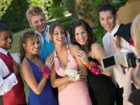 Prom Group Of Friends Being Videotaped At School Dance