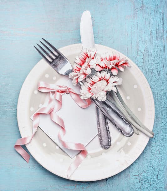 Lovely Table Place Setting In Pastel Color With Plate Cutlery Flowers And Card With Ribbon On Turquoise Blue Shabby Chic Background Top View Mock
