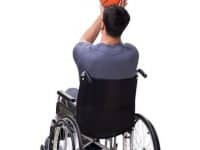 Basketball Player Recovering From Injury On Wheelchair