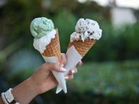 hand holding two ice cream cones