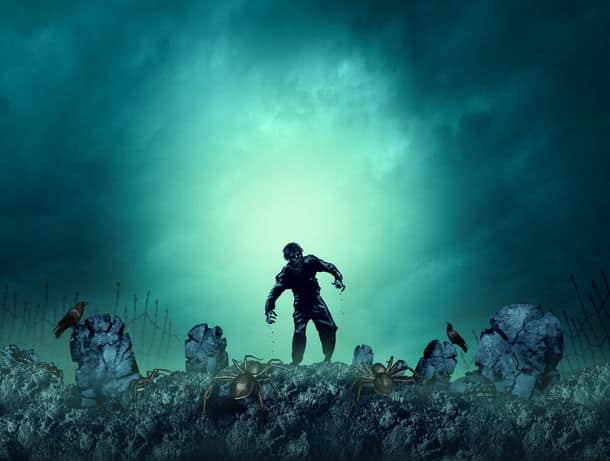 Zombie Grave Halloween Background As A Creepy Walking Monster In A Blank Area For Text As A Spooky Dead Scary Ghost As An Autumn Holiday Greeting With