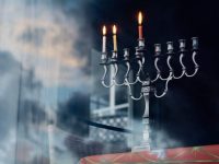 silver colored menorah with three candle