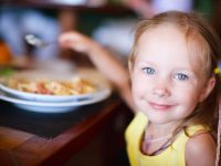 girl at restaurant kids eat free meal