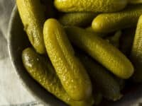 Several pickles in a bowl