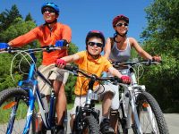 family riding bicycles