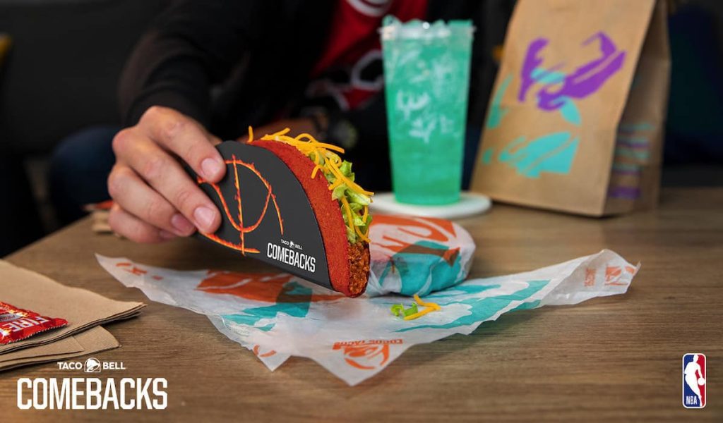 Hand holding Flamin' Hot Doritos Locos Taco