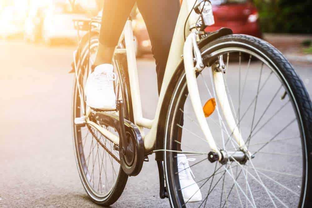 woman riding a white bike