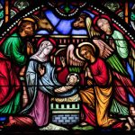 depiction of nativity in stained glass window