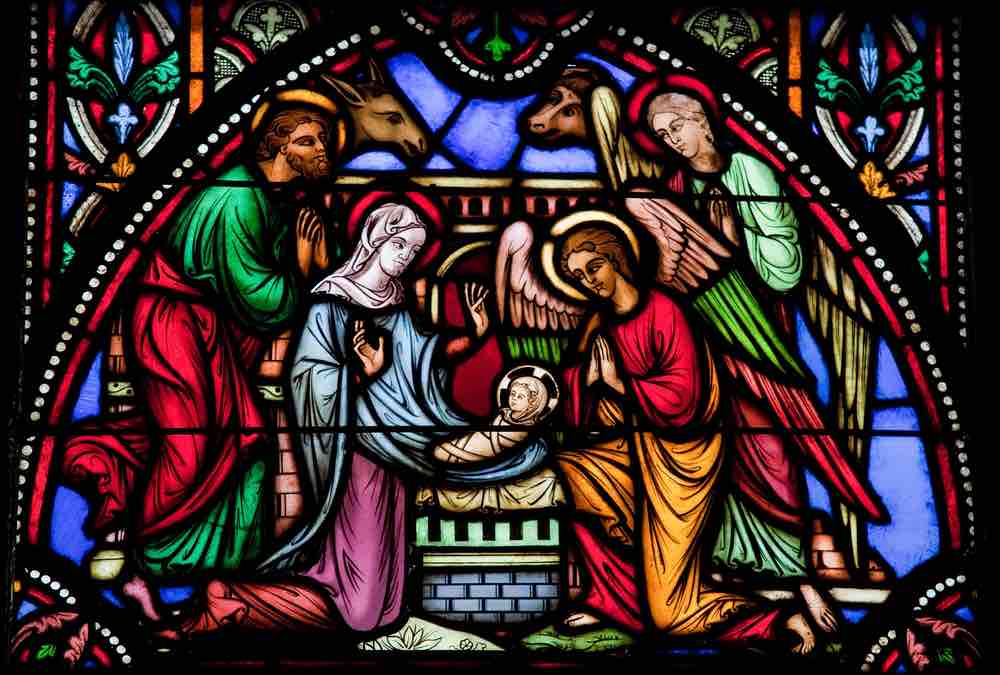 depiction of nativity in stained glass window
