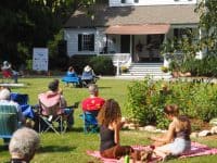 People on lawn listening to music