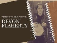 poster for Devon Flaherty in concert at Westgate Wine Bar, with picture of the artist with a banjo