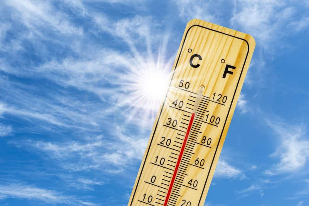 thermometer against blue sky, showing over 100 degrees F