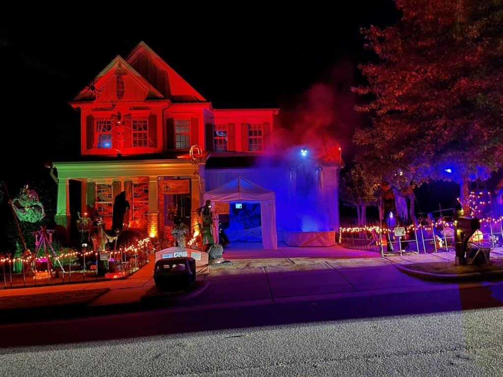 house decorated for Halloween with lights and props
