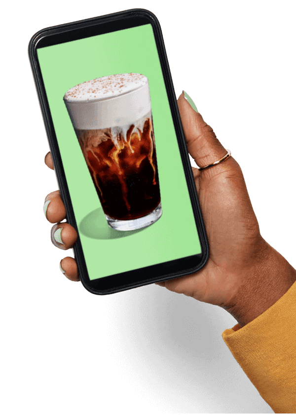 hand holding phone with picture of beverage on screen