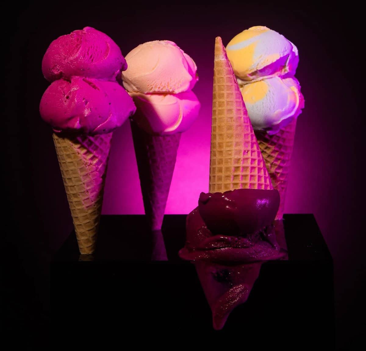 ice cream cones with black background and pink lighting