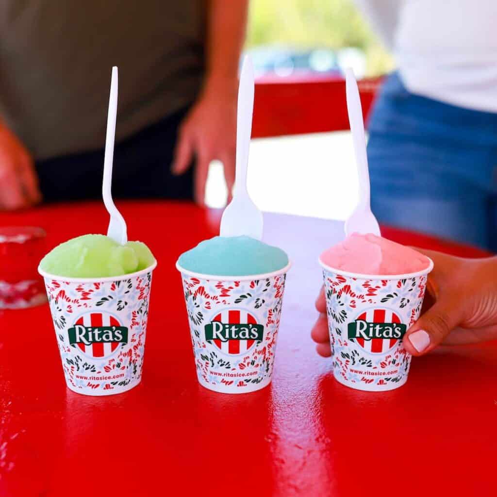 three cups on Italian Ice on a red table