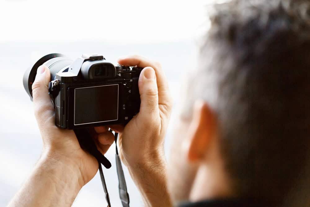 man taking a picture with a camera