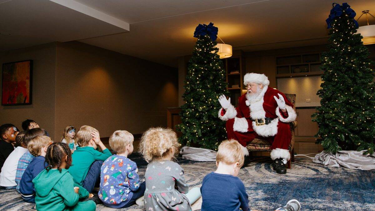 Santa telling story to children
