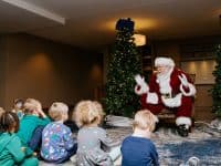 Santa telling story to children