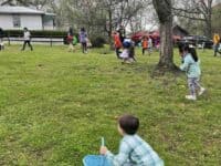 children on an egg hunt at West Point on the Eno