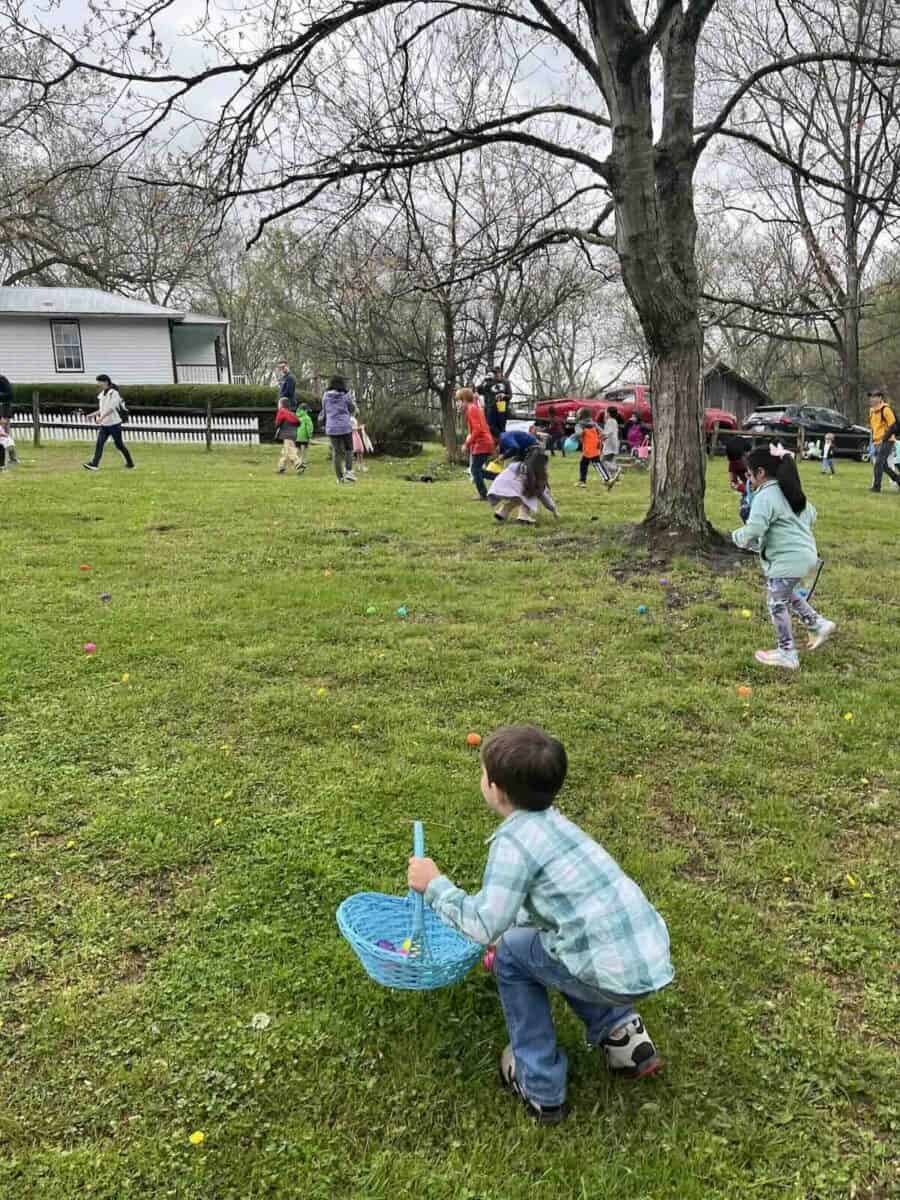 children on an egg hunt at West Point on the Eno