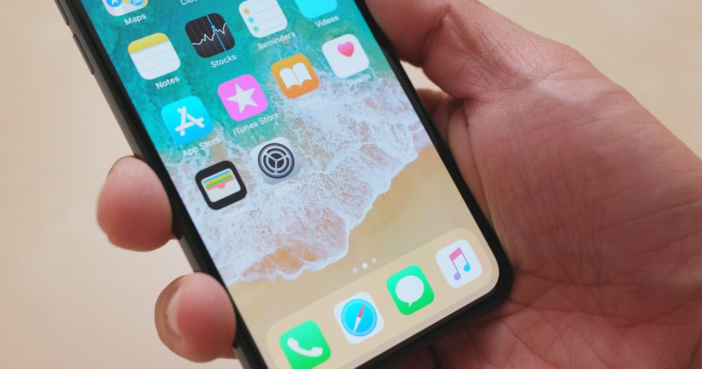 close-up of hand holding iPhone