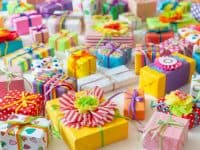 Colored gift boxes with colorful ribbons. White background. Gifts for Christmas or a birthday.