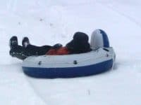 sledding in river tube