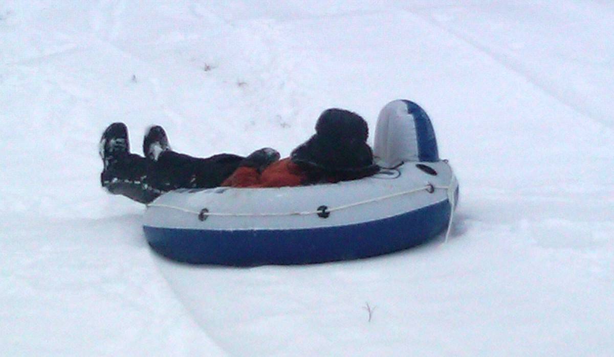 sledding in river tube
