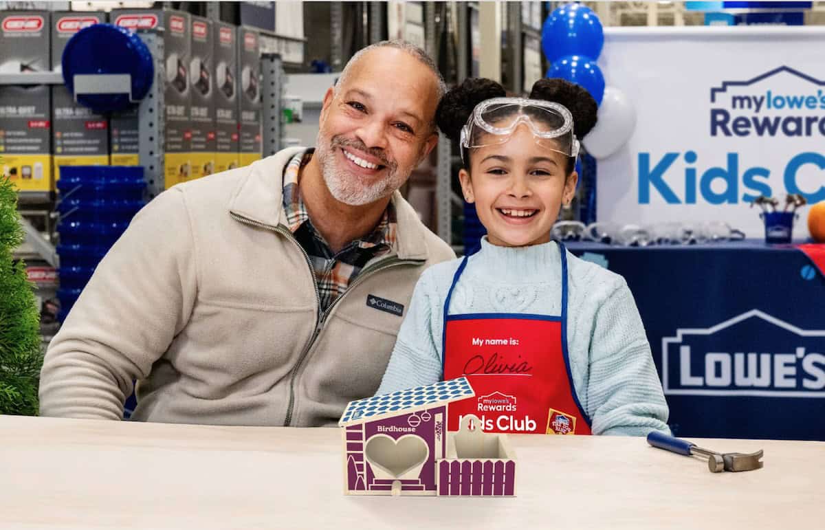 Man and child and birdhouse