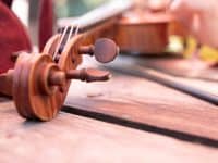 Violin on table outdoors, close-up