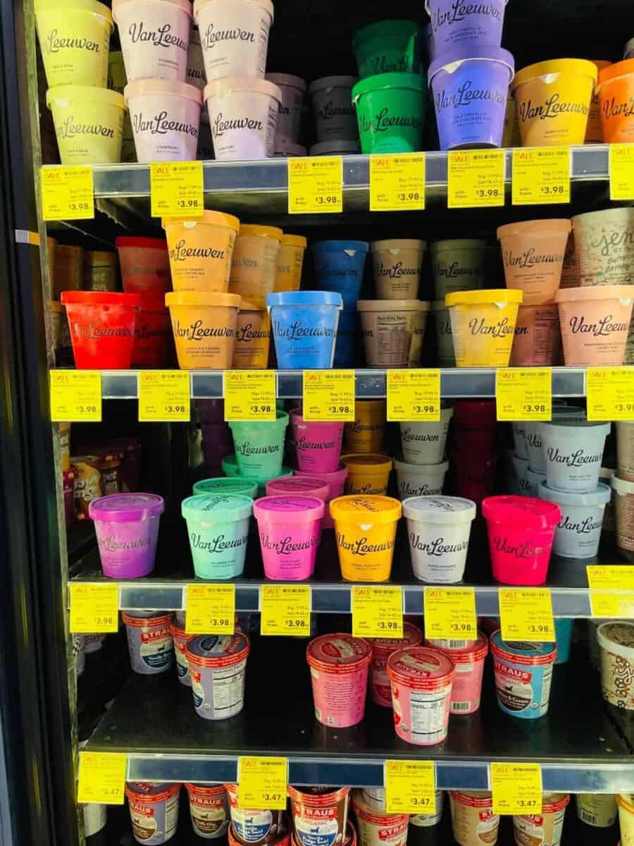 Pints of ice cream in freezer in store