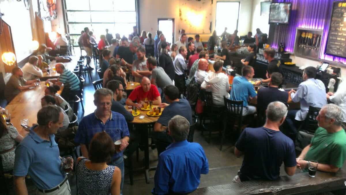Interior of Crank Arm Brewing, with crowd