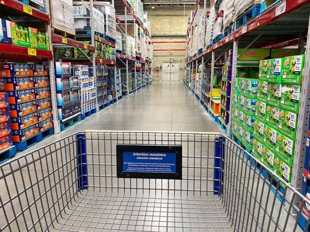 Interior of sam's Club, from behind a shopping cart on an aisle