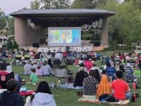 people watching an outdoor movie