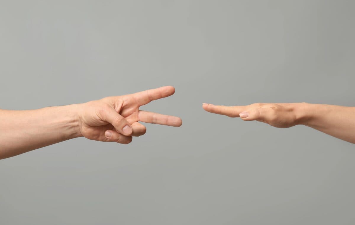 hands playing rock, paper scissors