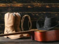 Cowboy boots, cowboy hat and guitar