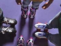 partial view of family in roller skates standing on roller rink